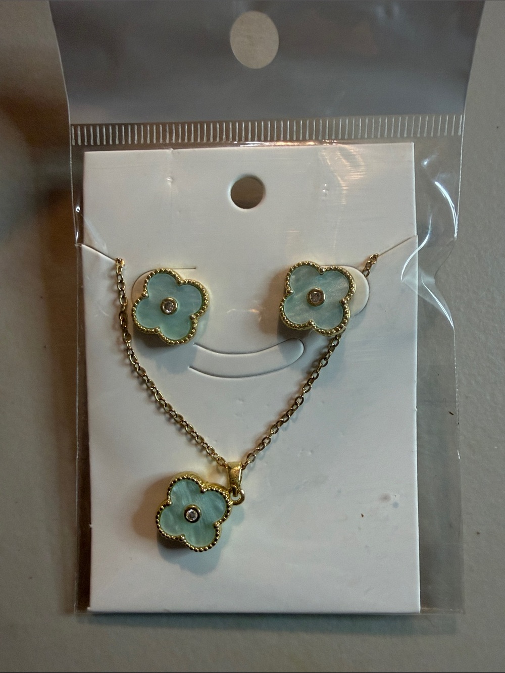Gold-Tone Necklace and Earring Set with Pale Aqua Flower Accents